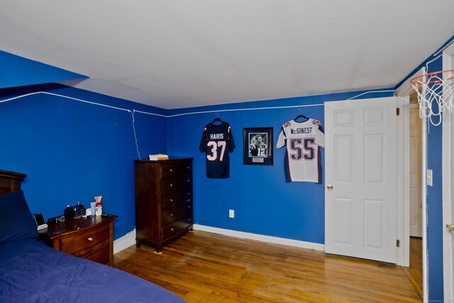 unfurnished bedroom featuring hardwood / wood-style floors