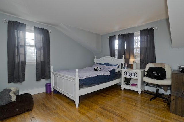 bedroom with hardwood / wood-style floors