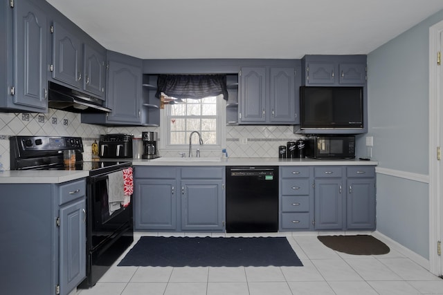 kitchen featuring light tile patterned flooring, sink, decorative backsplash, and black appliances