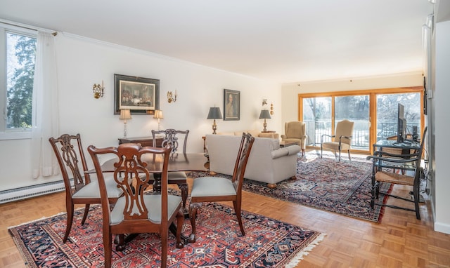 dining area with light parquet floors, a baseboard radiator, and ornamental molding