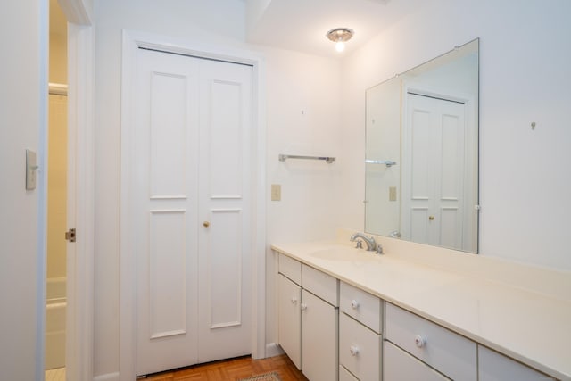 bathroom featuring vanity and parquet floors