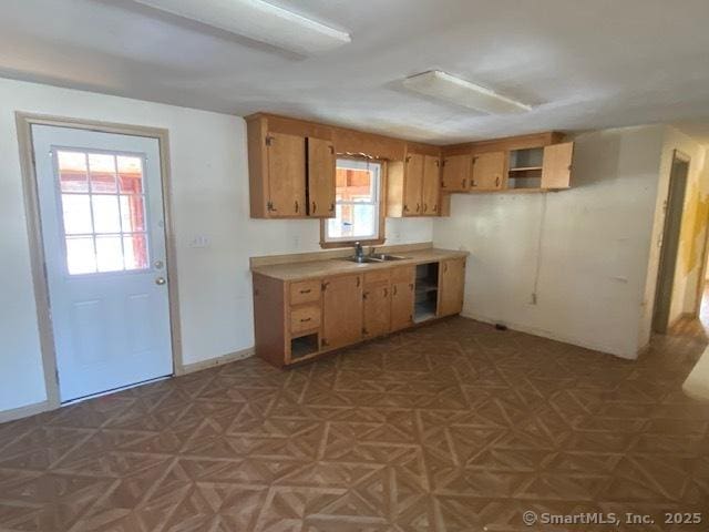 kitchen with sink and parquet flooring