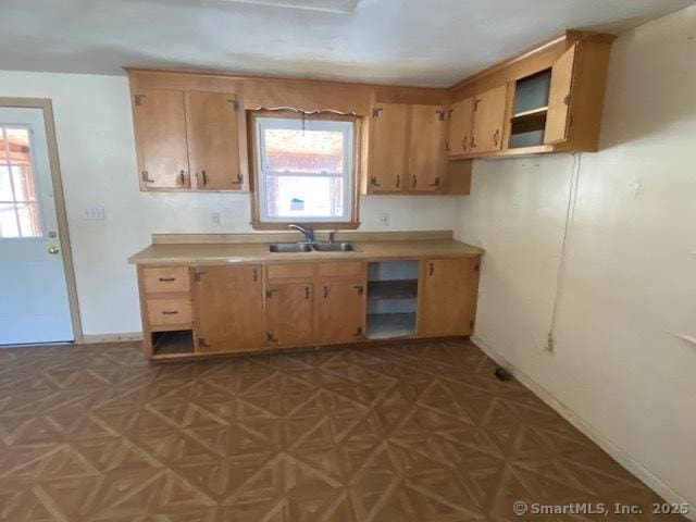 kitchen featuring sink and light parquet floors