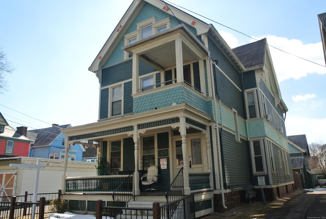 victorian house featuring a porch