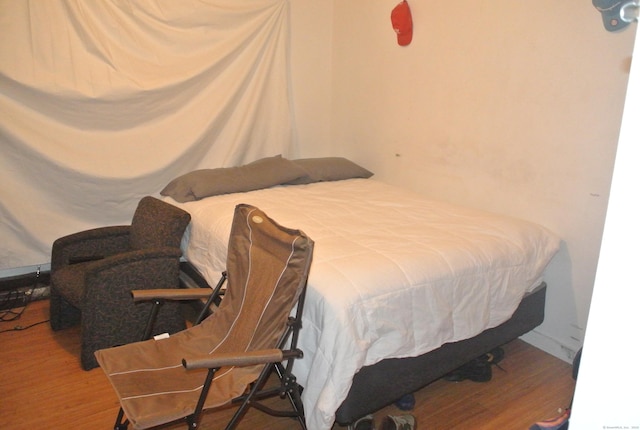 bedroom featuring wood finished floors