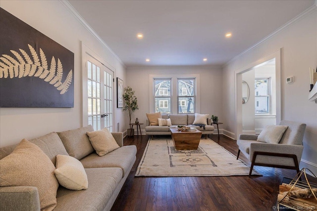 living room with hardwood / wood-style flooring, ornamental molding, and a wealth of natural light