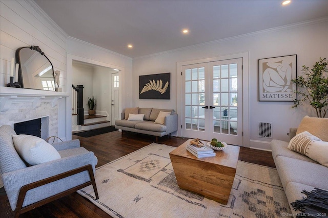 living room featuring french doors, dark hardwood / wood-style floors, and crown molding