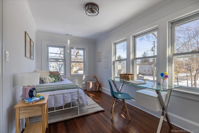 bedroom with crown molding and dark wood-type flooring