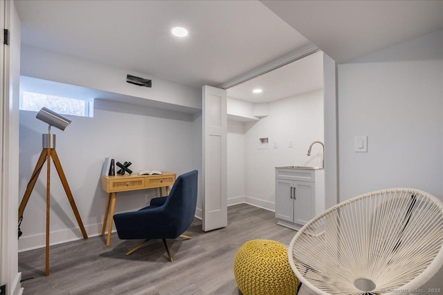 sitting room featuring light hardwood / wood-style floors