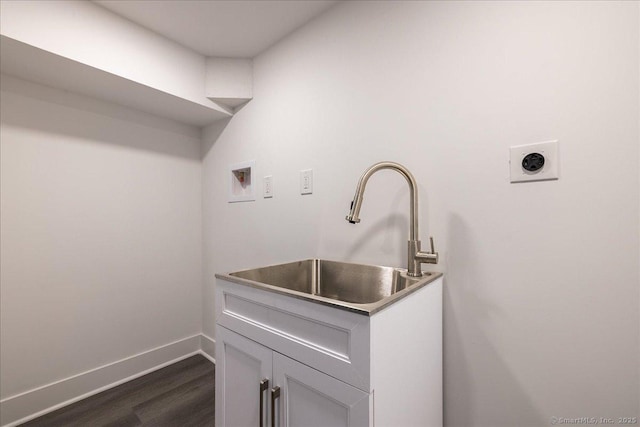 laundry area with sink, cabinets, washer hookup, dark wood-type flooring, and hookup for an electric dryer