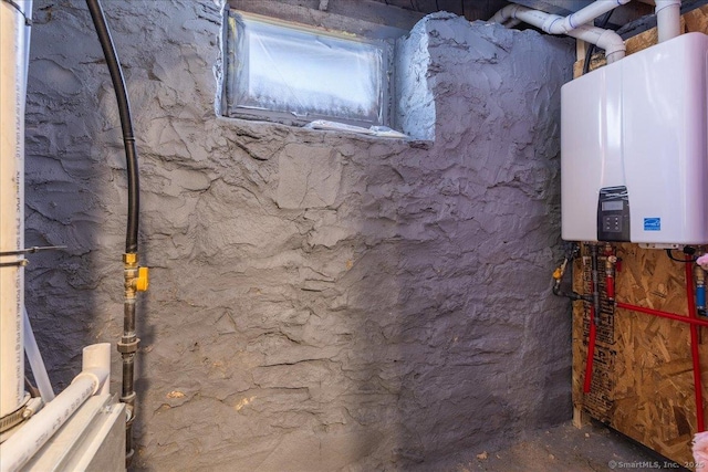 utility room featuring water heater