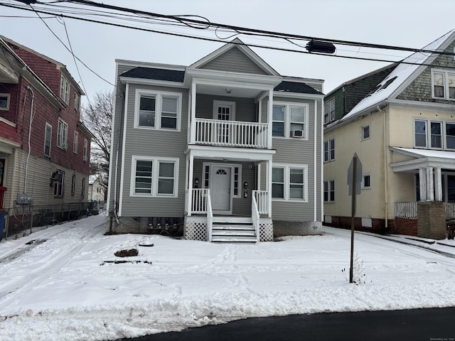 view of front of house with a balcony