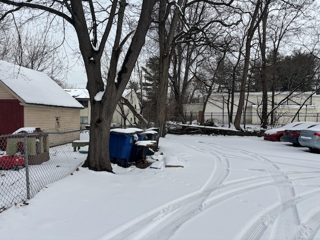 view of yard layered in snow