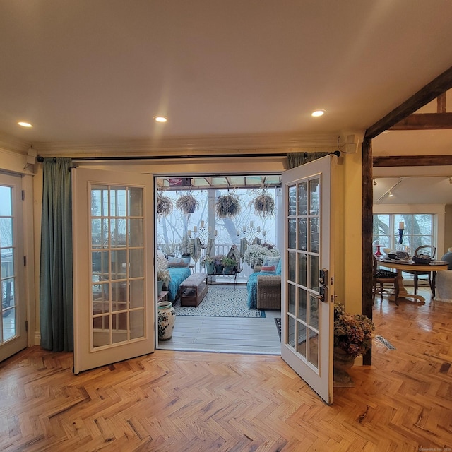 doorway to outside featuring light parquet floors and french doors