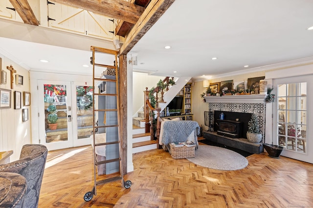 living area featuring french doors, crown molding, stairway, and recessed lighting