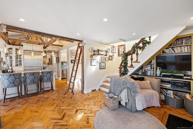 living room with stairs and recessed lighting
