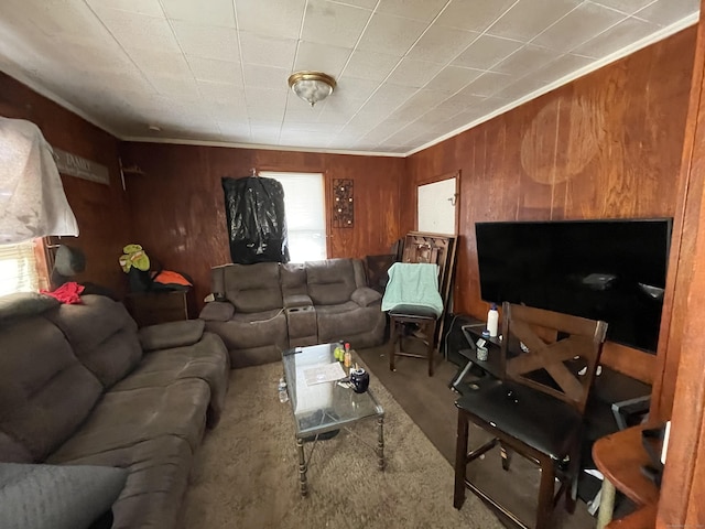 living room featuring crown molding and wood walls