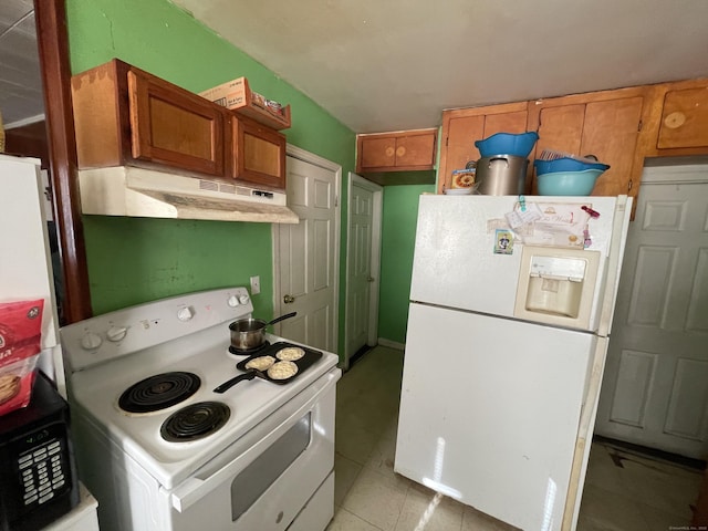 kitchen with light tile patterned floors and white appliances