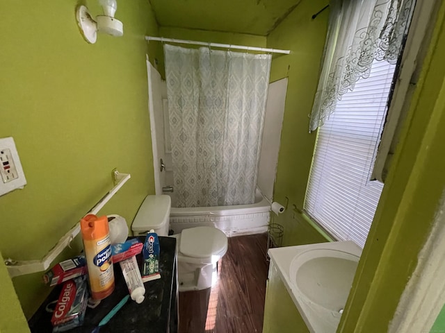 bathroom featuring hardwood / wood-style flooring, vanity, curtained shower, and toilet