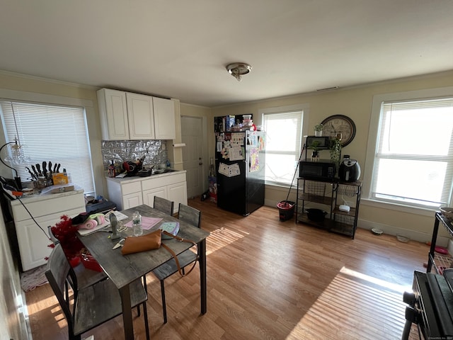 dining area with light hardwood / wood-style flooring