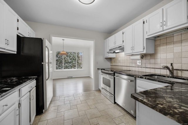 kitchen with tasteful backsplash, stainless steel appliances, sink, and white cabinets