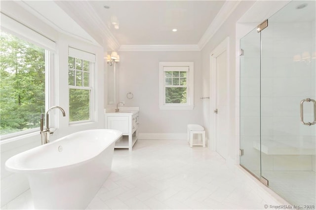 bathroom with vanity, ornamental molding, and independent shower and bath