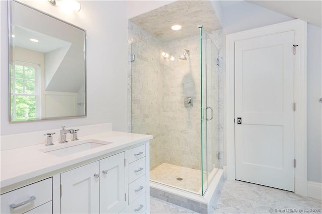 bathroom with vanity and an enclosed shower