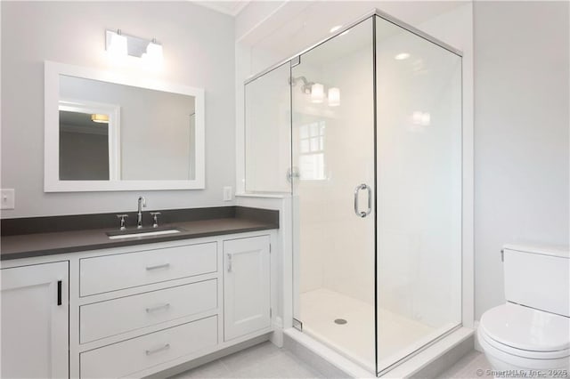 bathroom featuring vanity, an enclosed shower, tile patterned flooring, and toilet