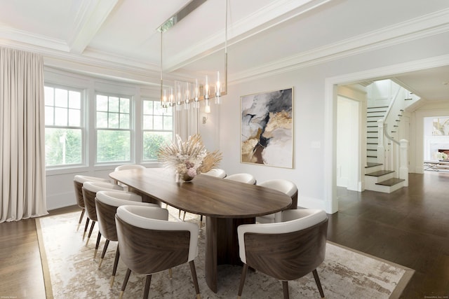 dining space with ornamental molding, dark wood-type flooring, an inviting chandelier, and beam ceiling