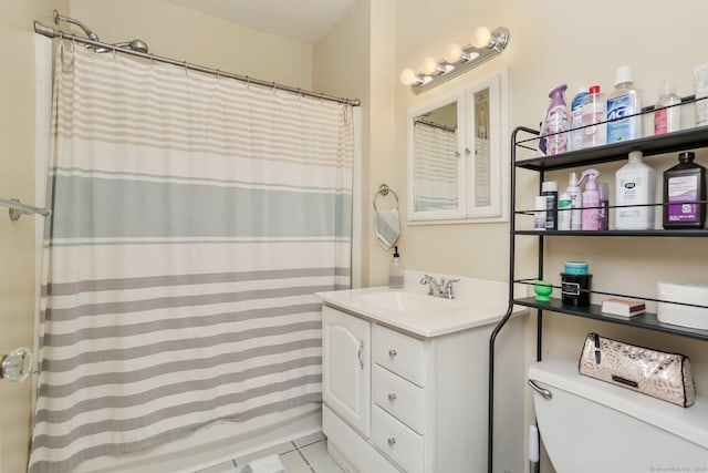 bathroom with toilet and vanity