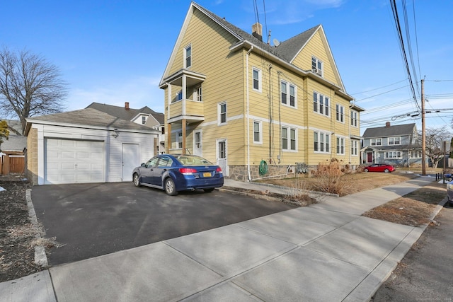 view of home's exterior with a garage and a residential view