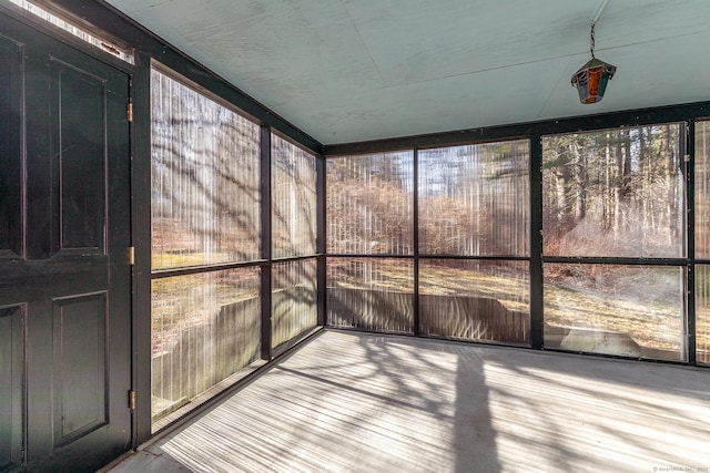 unfurnished sunroom featuring wood finished floors