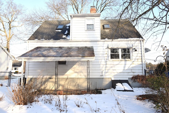 view of snow covered house