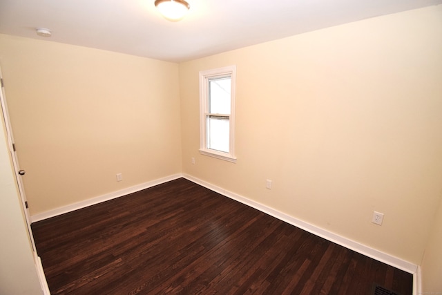 spare room featuring hardwood / wood-style floors