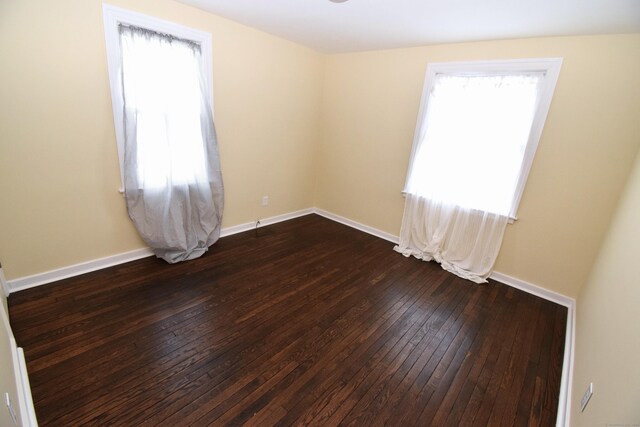 empty room featuring dark wood-type flooring