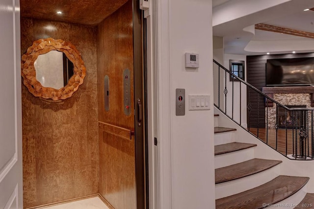 staircase featuring elevator