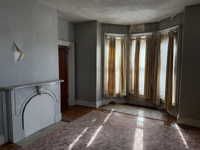 interior space featuring light wood-style flooring and baseboards