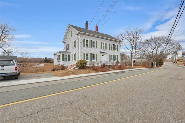 view of front of house with a chimney