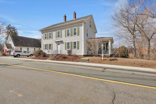 view of front of property featuring a chimney