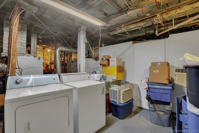 clothes washing area featuring laundry area and washer and dryer