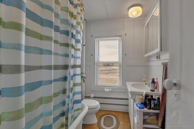 bathroom featuring a baseboard heating unit, a shower with shower curtain, vanity, and toilet