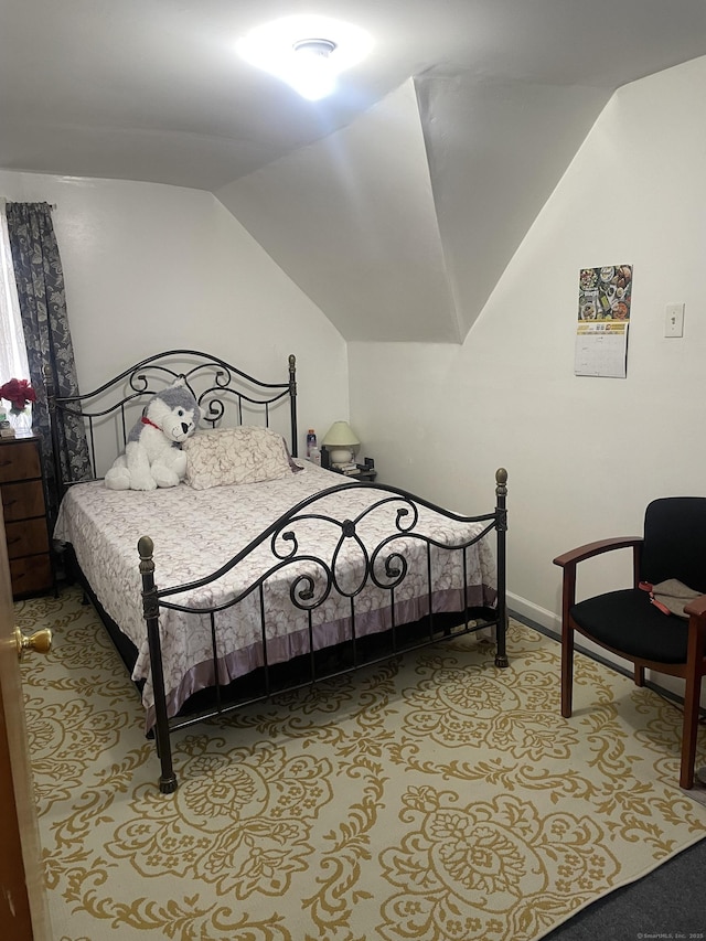 bedroom with vaulted ceiling