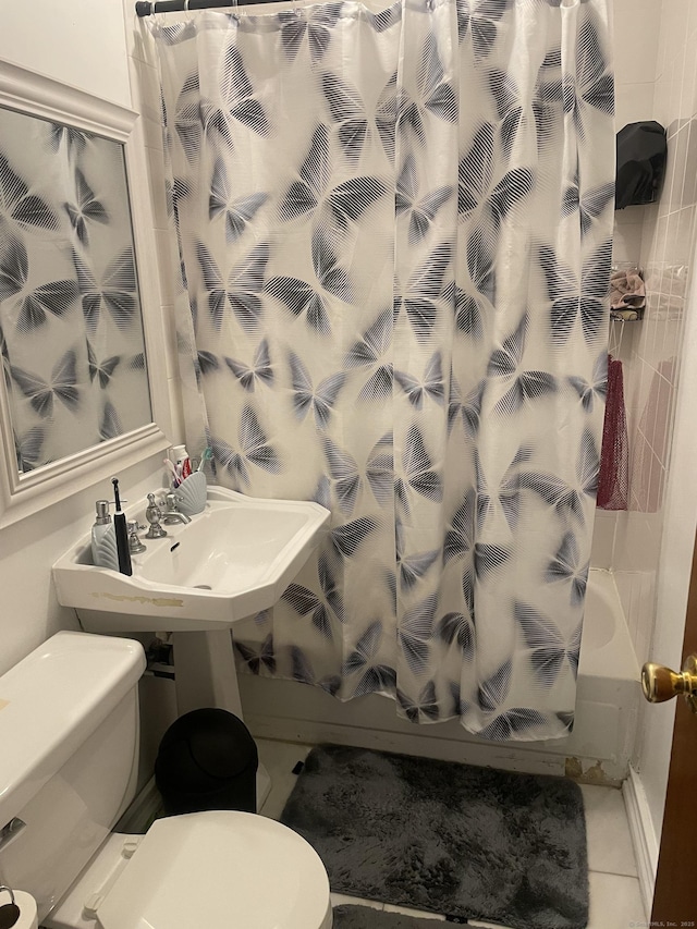 bathroom with shower / bathtub combination with curtain and tile patterned floors