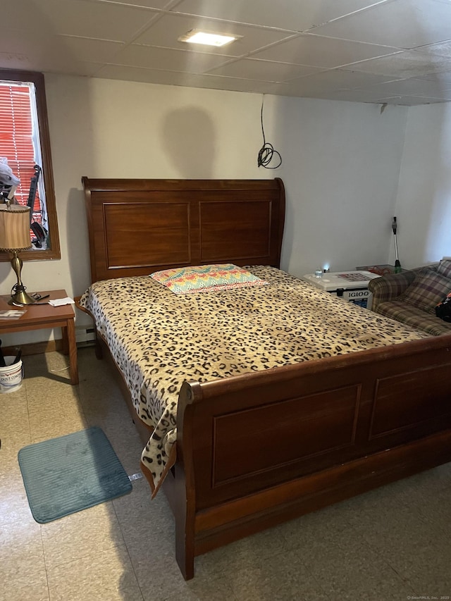 bedroom featuring a paneled ceiling