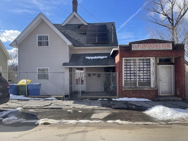 view of front of property with solar panels