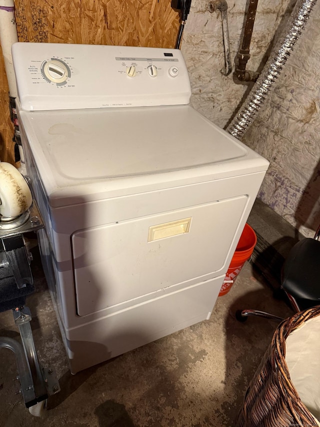 clothes washing area featuring washer / dryer and laundry area