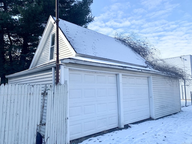 view of snow covered garage