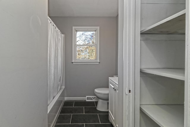 full bathroom with shower / bath combo with shower curtain, tile patterned floors, toilet, and vanity