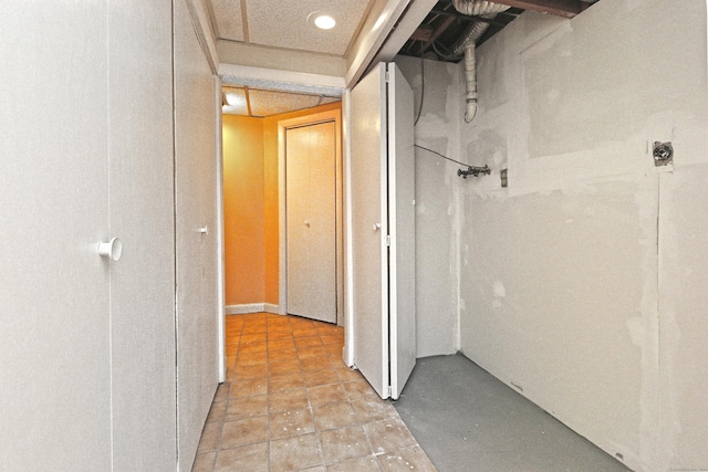 corridor featuring light tile patterned floors