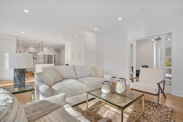 living room with light hardwood / wood-style flooring